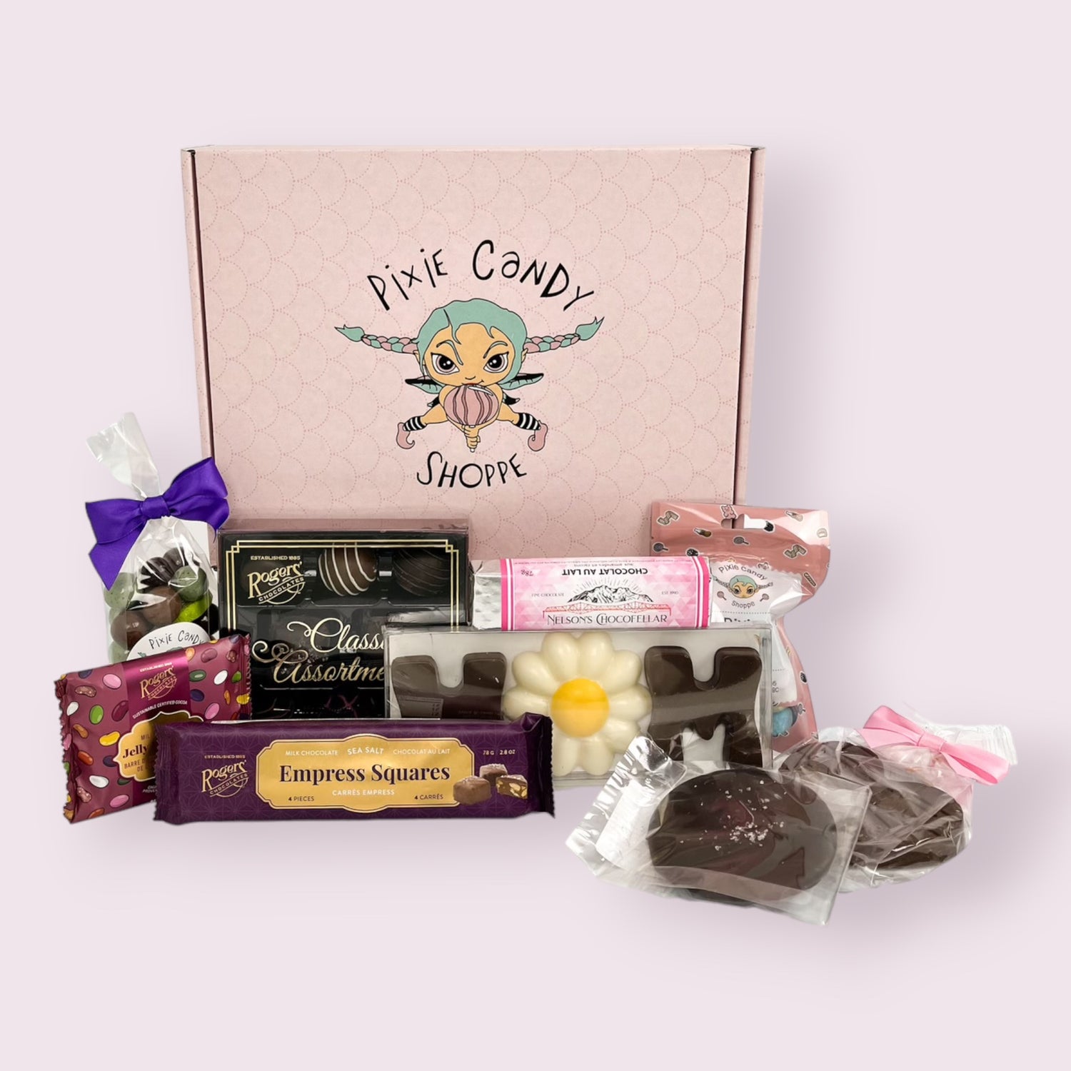 A birthday themed pixie's magical mystery box with it's contents displayed in front. 