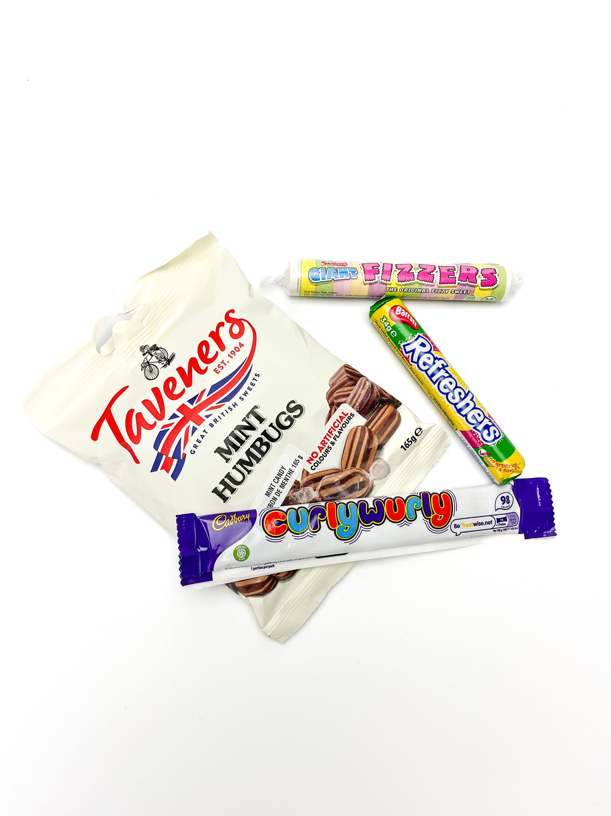 A package of taveners mint humbugs, barret refreshers, giant fizzers, and a curlywurly bar displayed on a white background.